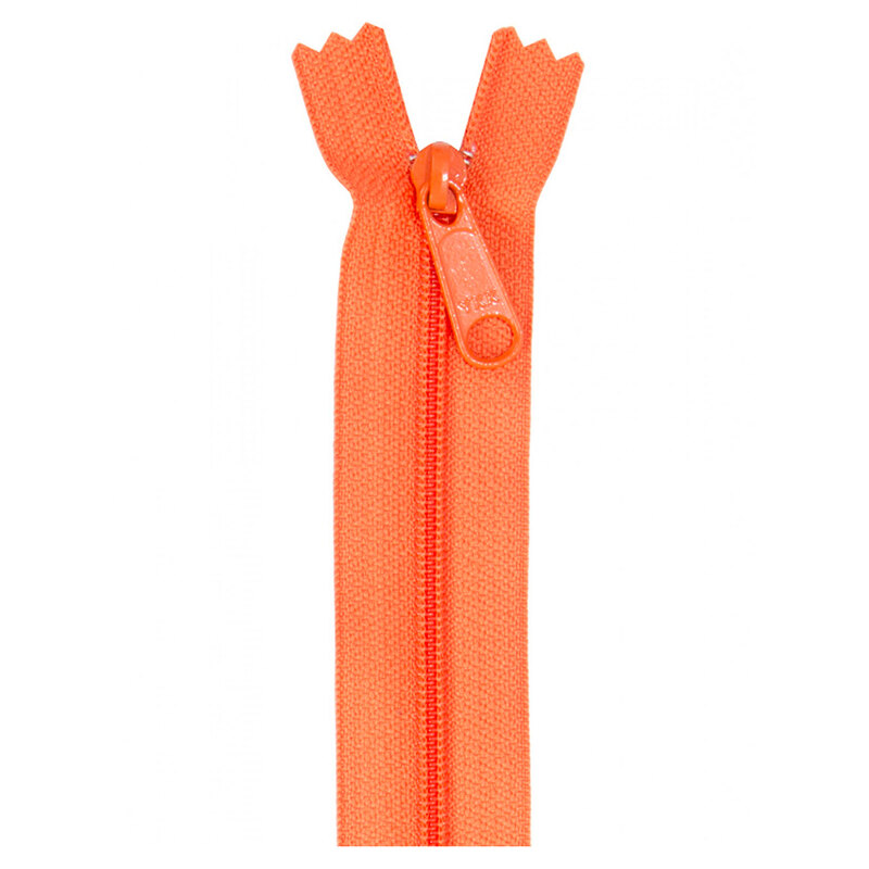 Photo of a orange zipper isolated on a white background