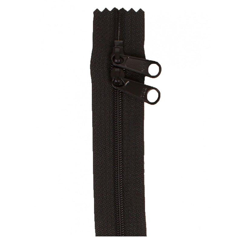 Photo of a black zipper with two pull tabs isolated on a white background