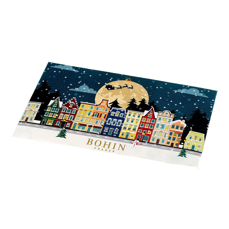 Front of a pack of needles featuring a quaint christmas town with snow and the silhouette of santa's sleigh over the moon. Labeled with the brand name bohin