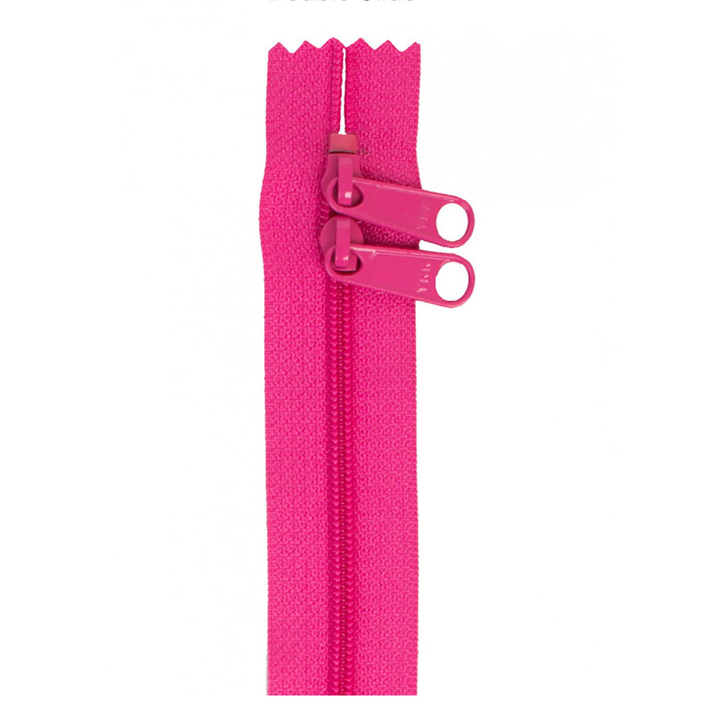 Photo of a bright pink zipper with two pull tabs isolated on a white background