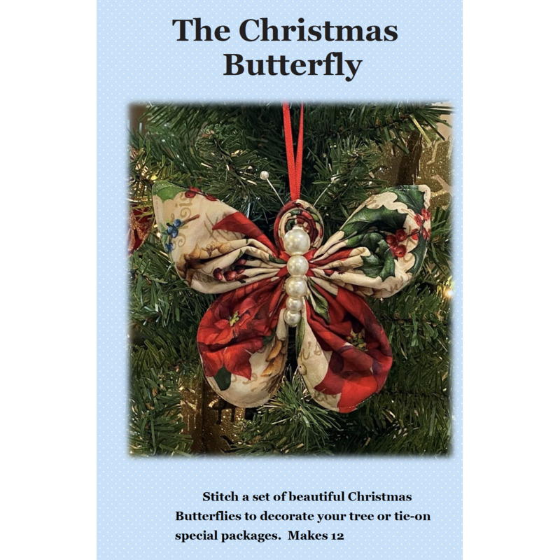 Front cover of the Christmas Butterfly ornament pattern with a blue cover and a christmas themed butterfly ornament hung from a Christmas tree on it