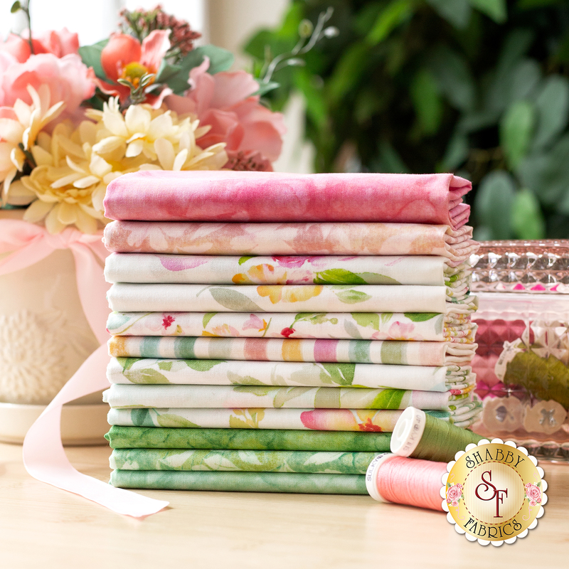 A photo of a stack of light floral pink and green fabrics in the Sweet Surrender fat quarter set