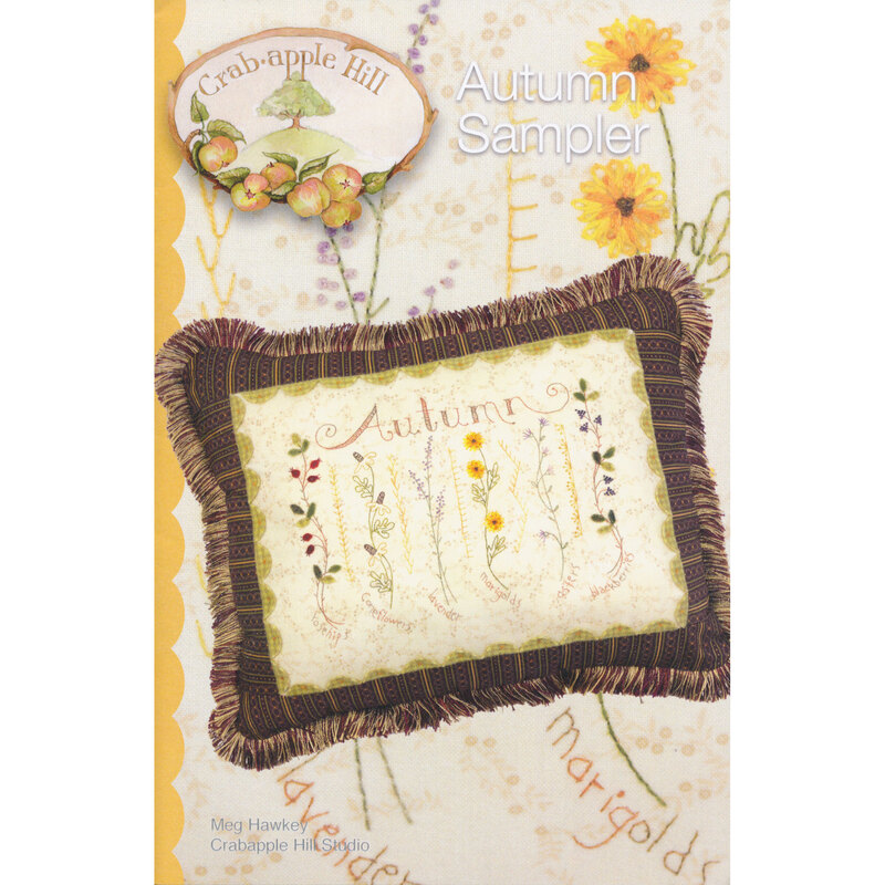 The front of the Autumn Sampler pattern by Crabapple Hill Studio showing an embroidered pillow