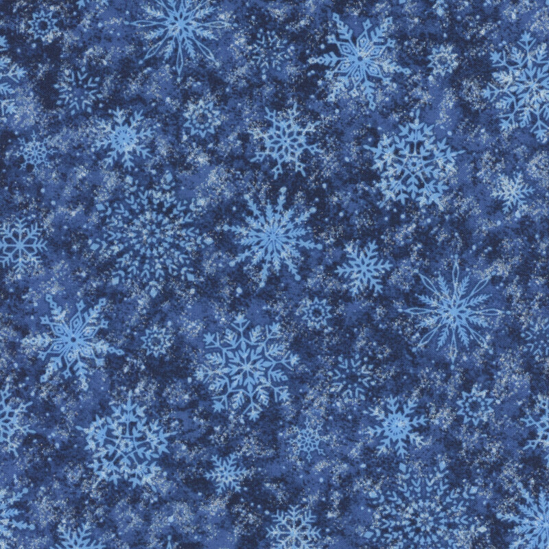 Tossed detailed light blue snowflakes on a midnight blue background