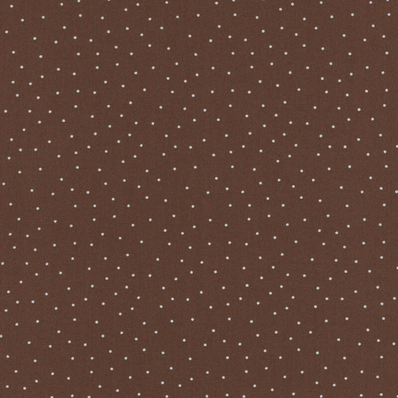 fabric featuring a warm brown background with scattered small white dots