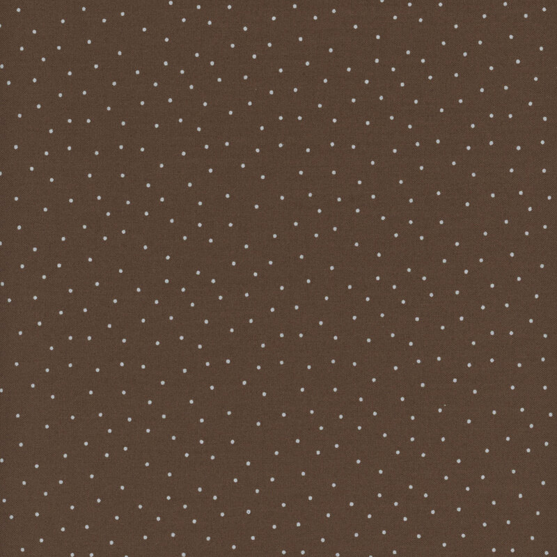 fabric featuring a warm brown background with scattered small white dots