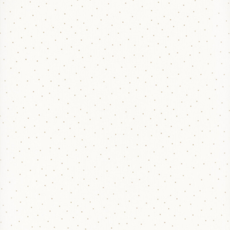 fabric featuring a light cream background with scattered small tan dots