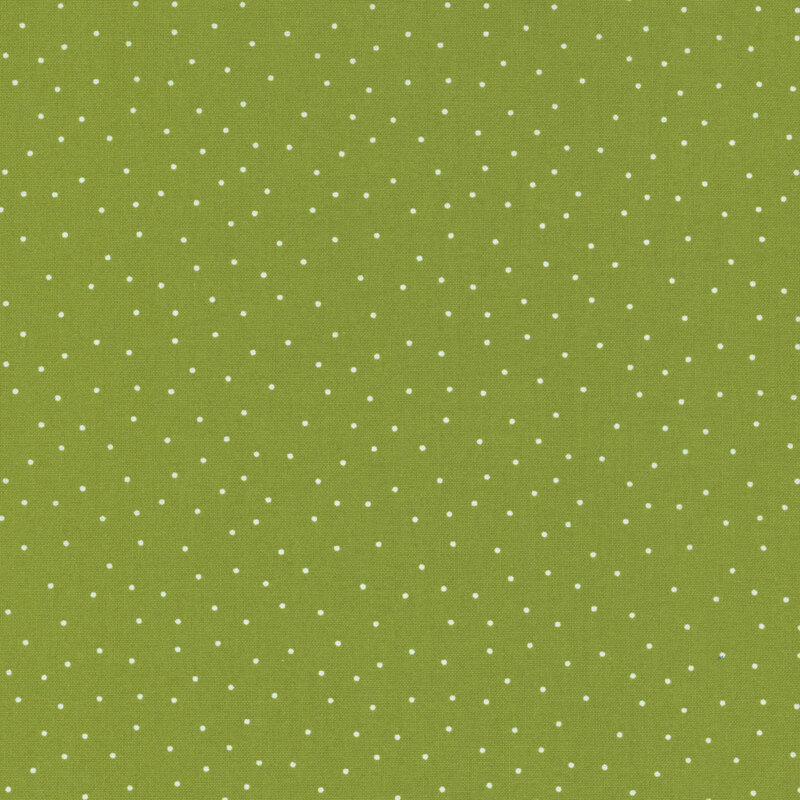 fabric featuring a light olive green background with scattered small white dots