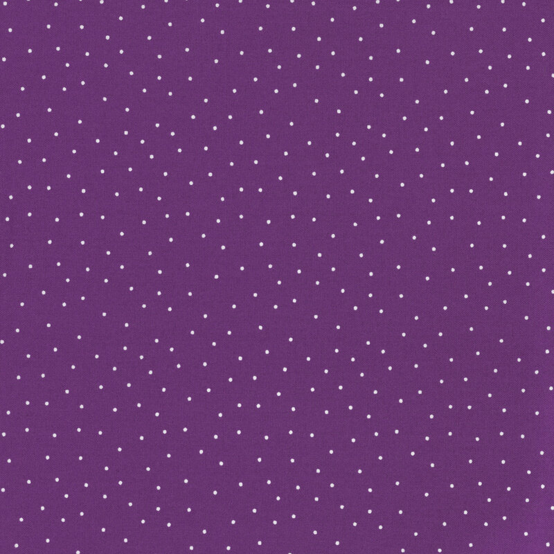 fabric featuring a purple background with scattered small white dots