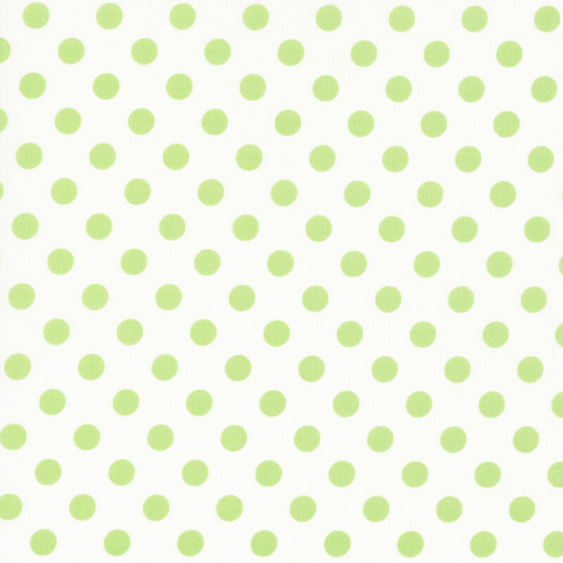 fabric featuring a white background with pale green polka dots