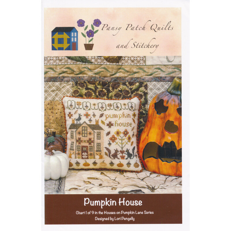 Front of pattern 1 of 9: the finished pumpkin house cross-stitched pillow