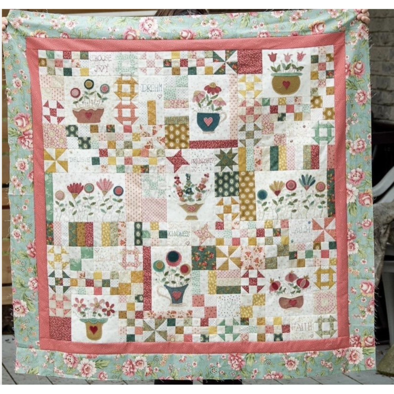 Patchwork quilt featuring flowerpots and forget-me-nots
