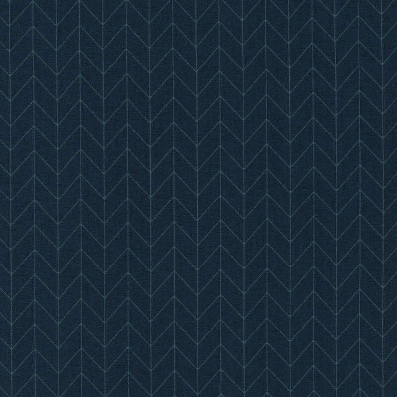 navy blue fabric featuring a lighter navy chevron pattern
