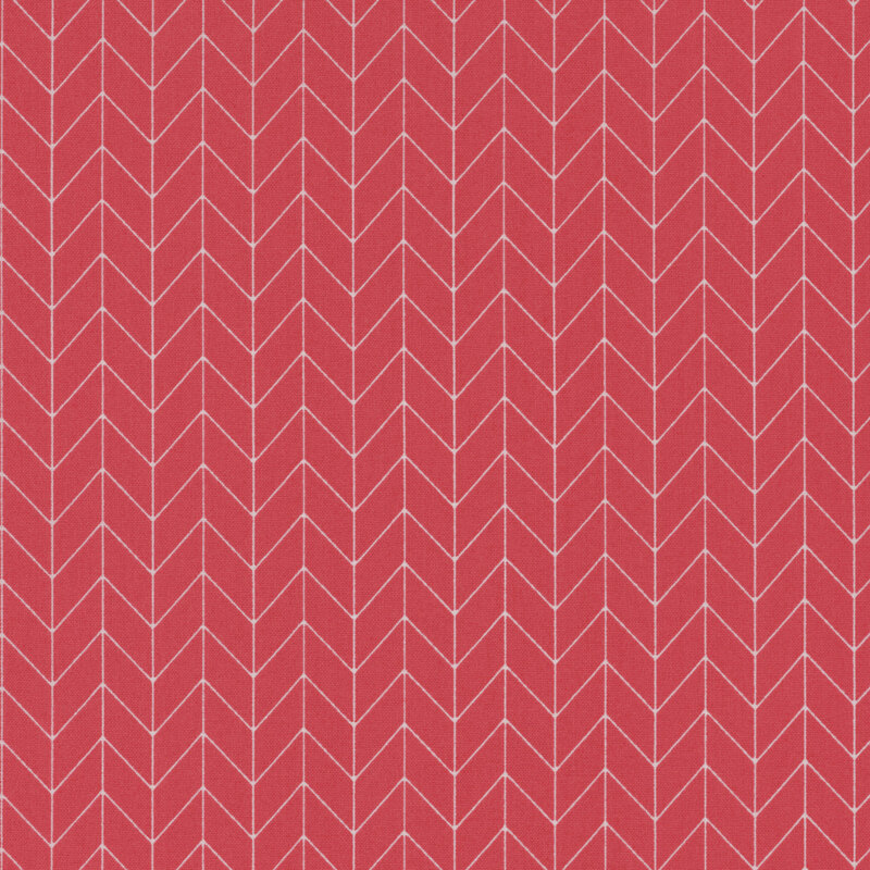 pink fabric featuring a white chevron pattern