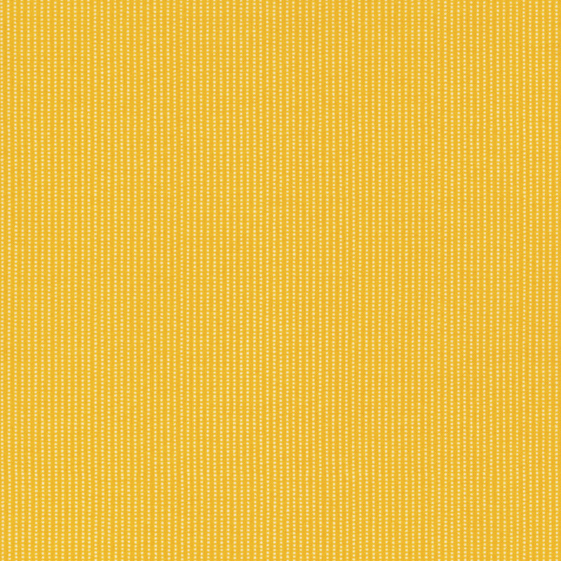 yellow fabric featuring white dotted stripes