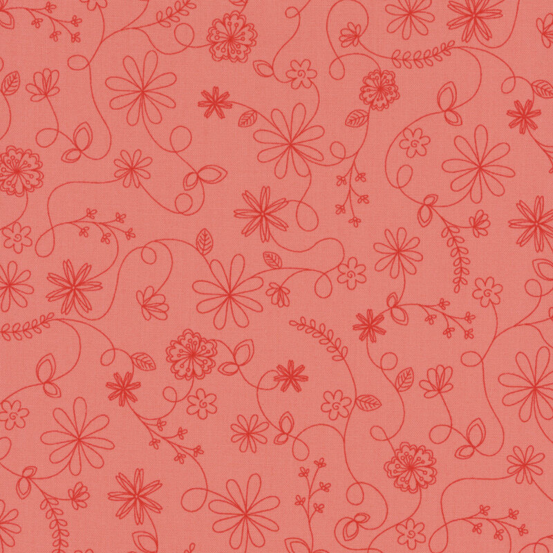 pink fabric featuring a swirling vine floral pattern in red