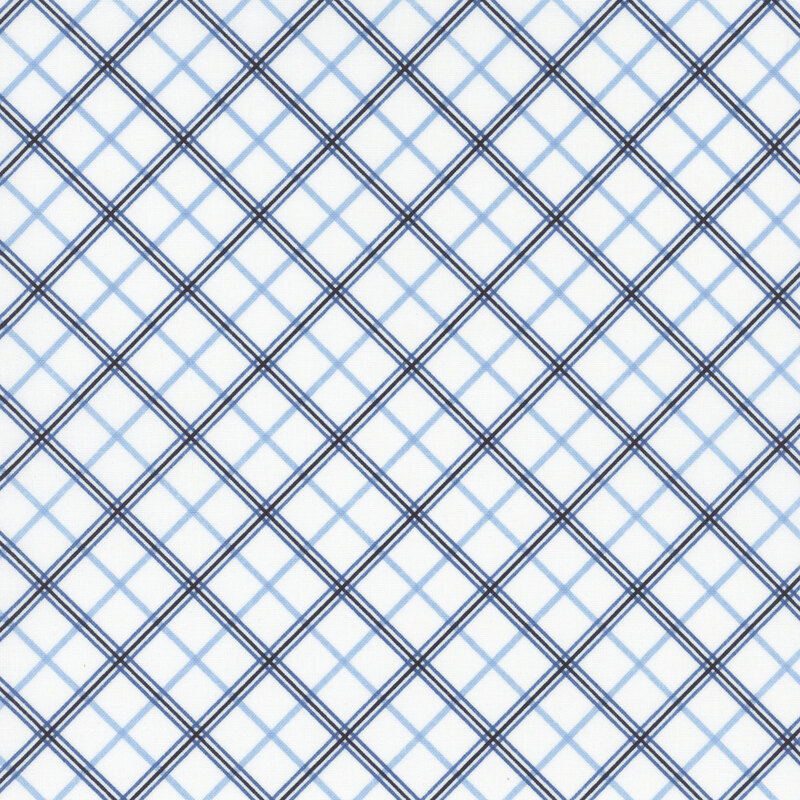 white fabric featuring diagonal blue plaid in three different shades
