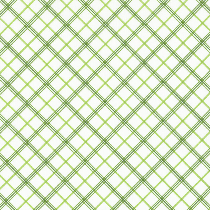 white fabric featuring diagonal green plaid in three different shades