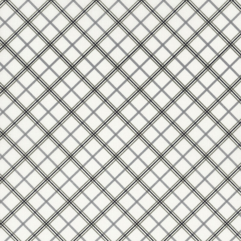 white fabric featuring diagonal black and gray plaid in three different shades