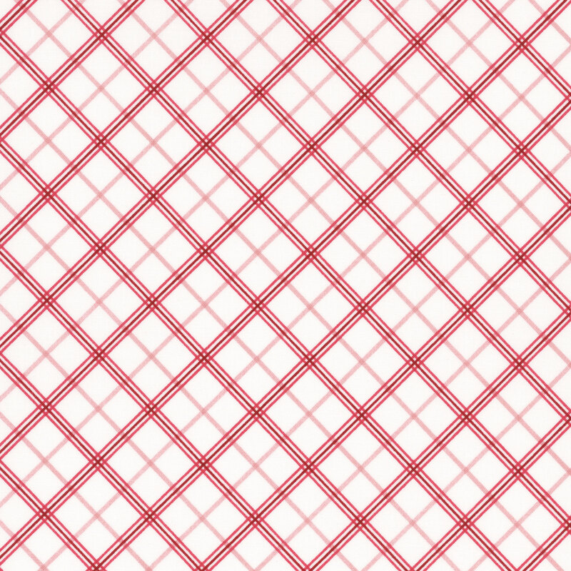 white fabric featuring diagonal red plaid in three different shades