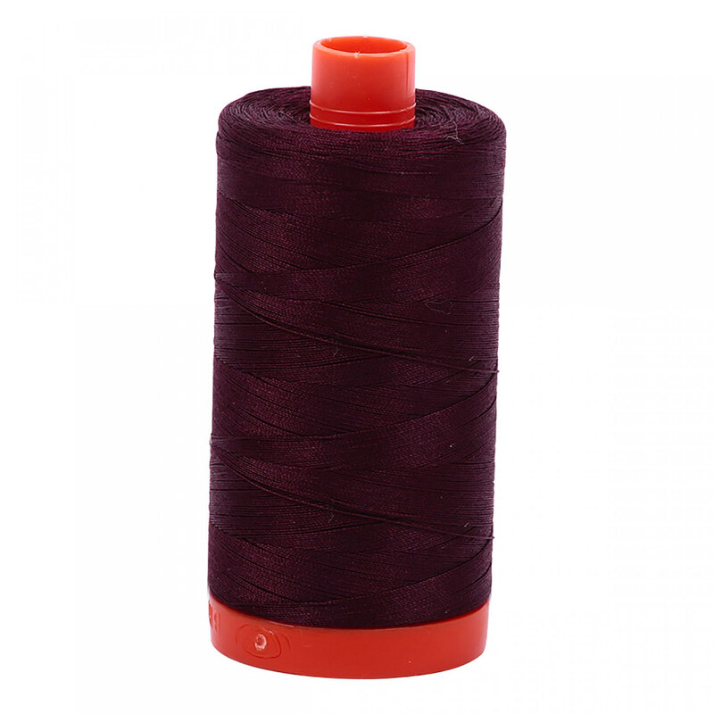 A spool of Aurifil 2460 - Very Dark Brown thread on a white background, tones of deep rust brown, like a dark chocolate, a devil's food cake brown