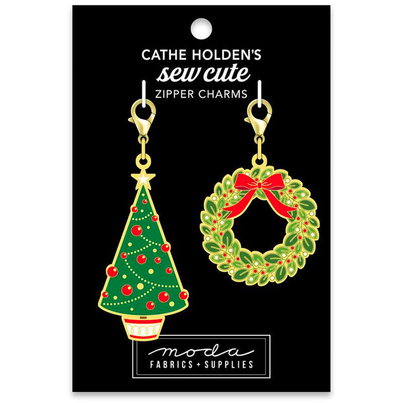 Image of a black tag with 2 Christmas themed zipper pulls of a Christmas tree and a wreath