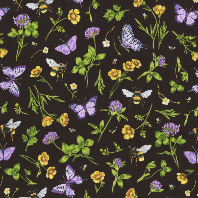 black fabric featuring scattered bees, clover flowers, four-leaf clovers, purple butterflies, and yellow flowers