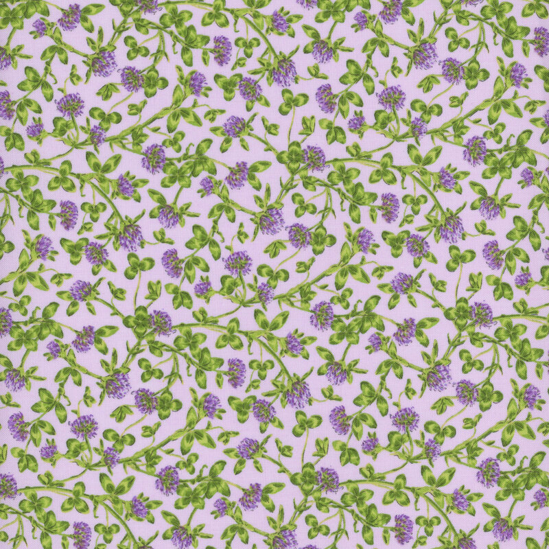 light purple fabric featuring overlapping clover flowers and vines