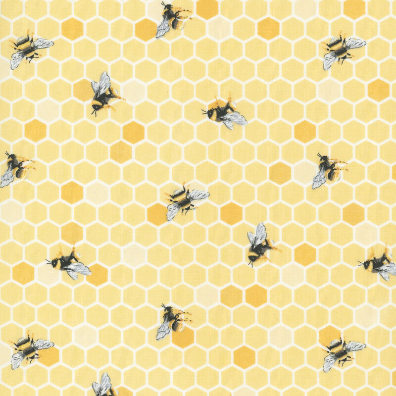 light yellow honeycomb fabric featuring scattered honeybees