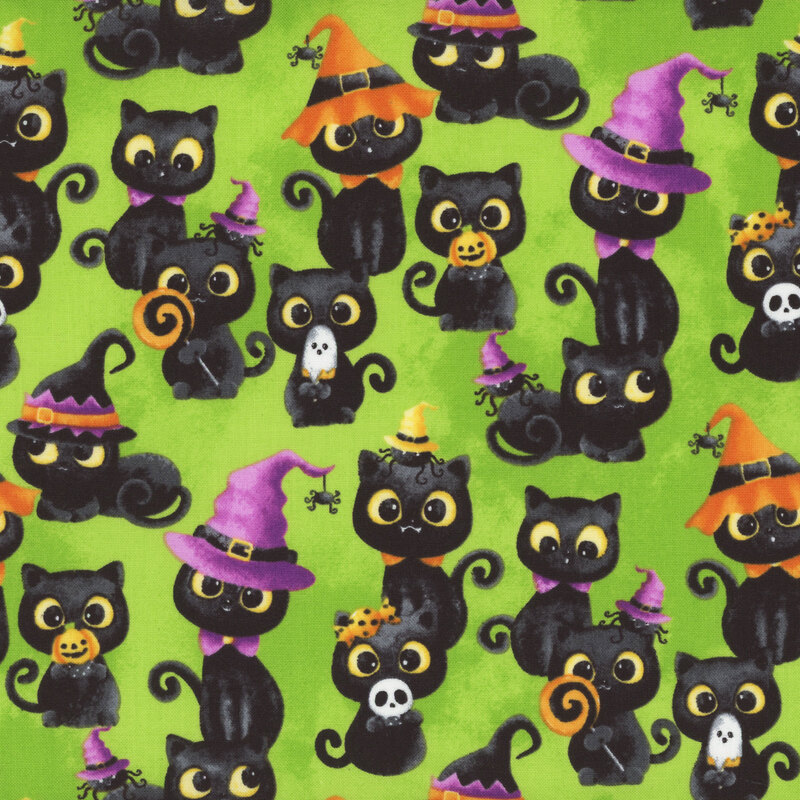 vibrant green fabric featuring scattered adorable black cats, with each doing something different, such as wearing a witch hat, wearing a candy bow, sitting with a spider friend, or eating some Halloween candy
