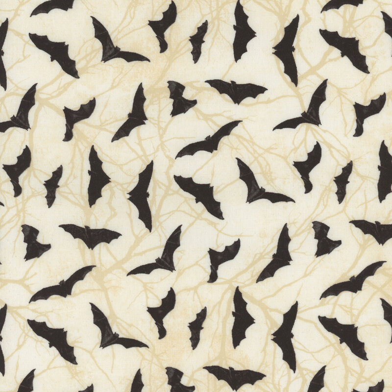 lovely cream fabric featuring scattered black bats over cream tonal marbling