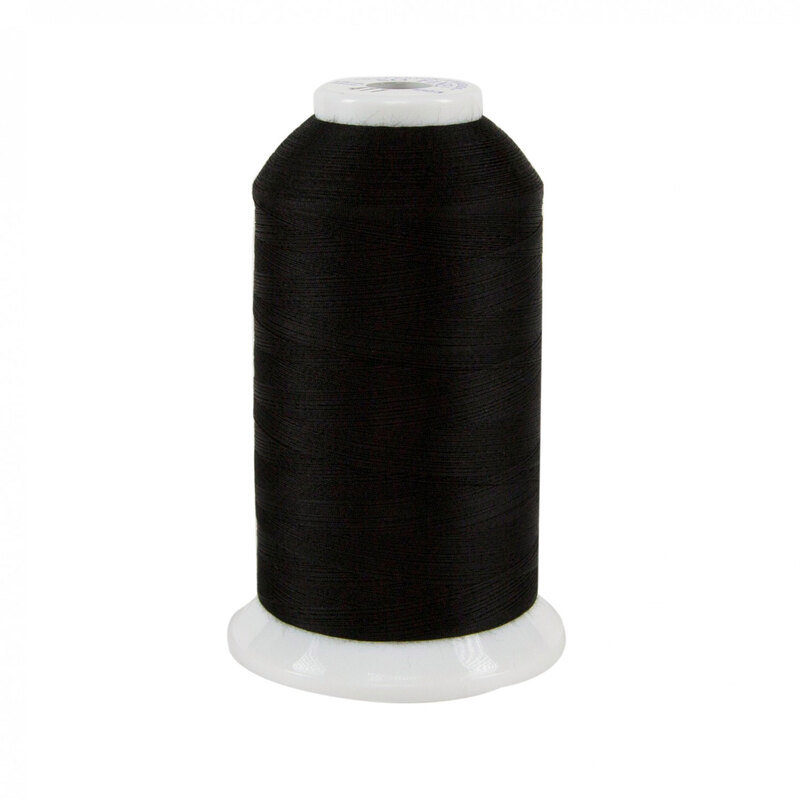 Spool of black So Fine! thread on a white background