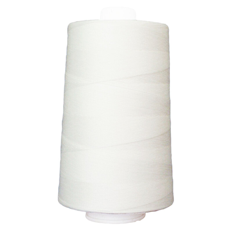 Large spool of white thread on a white background