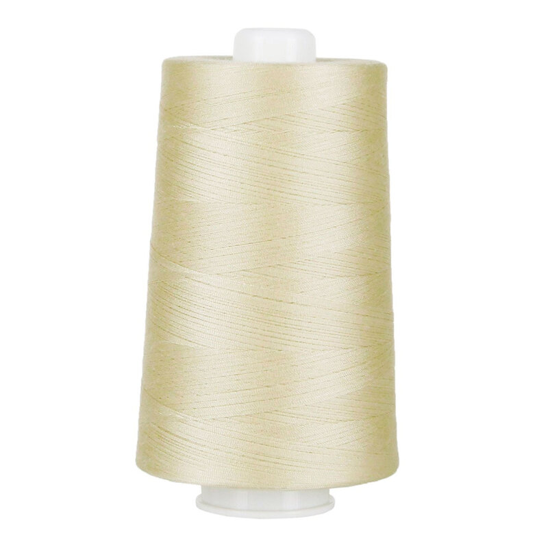 Large spool of beige thread on a white background