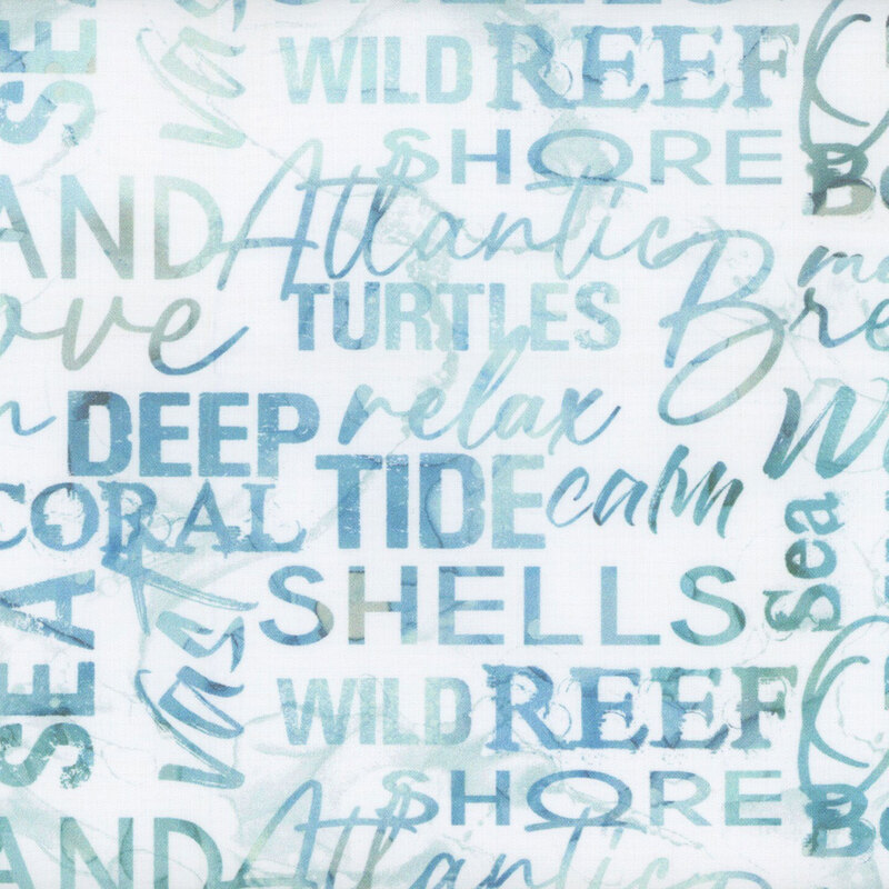 White and blue mottled fabric with ocean-themed words packed together perpendicular to one another