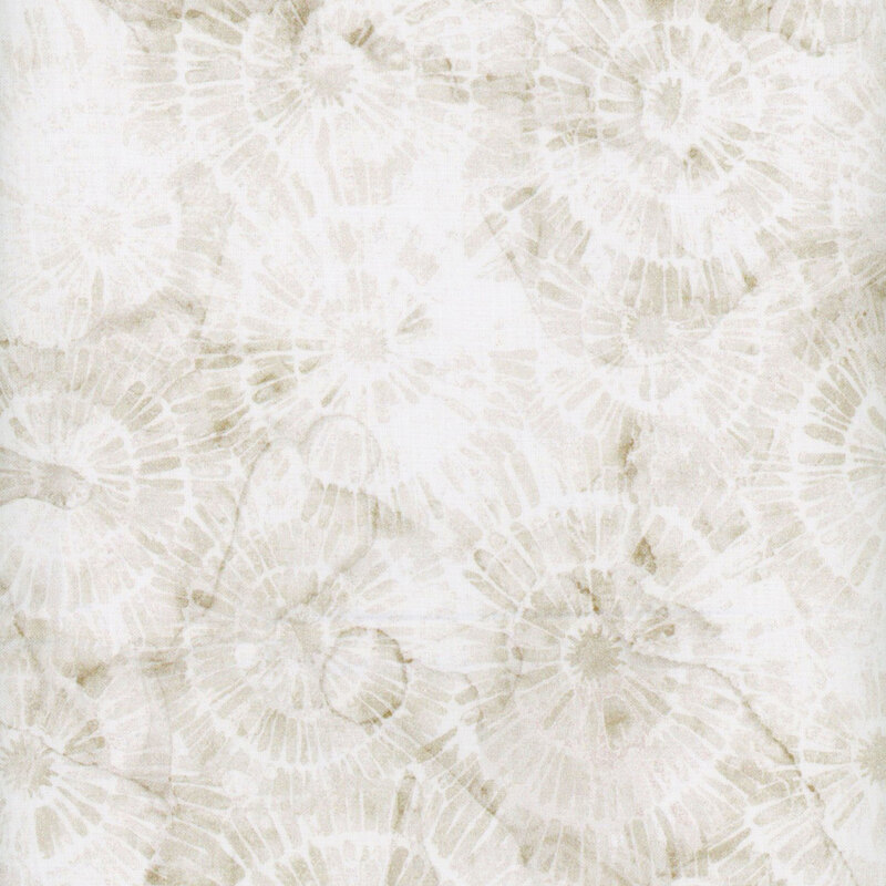 tonal, mottled white and cream fabric with circular patterns all over