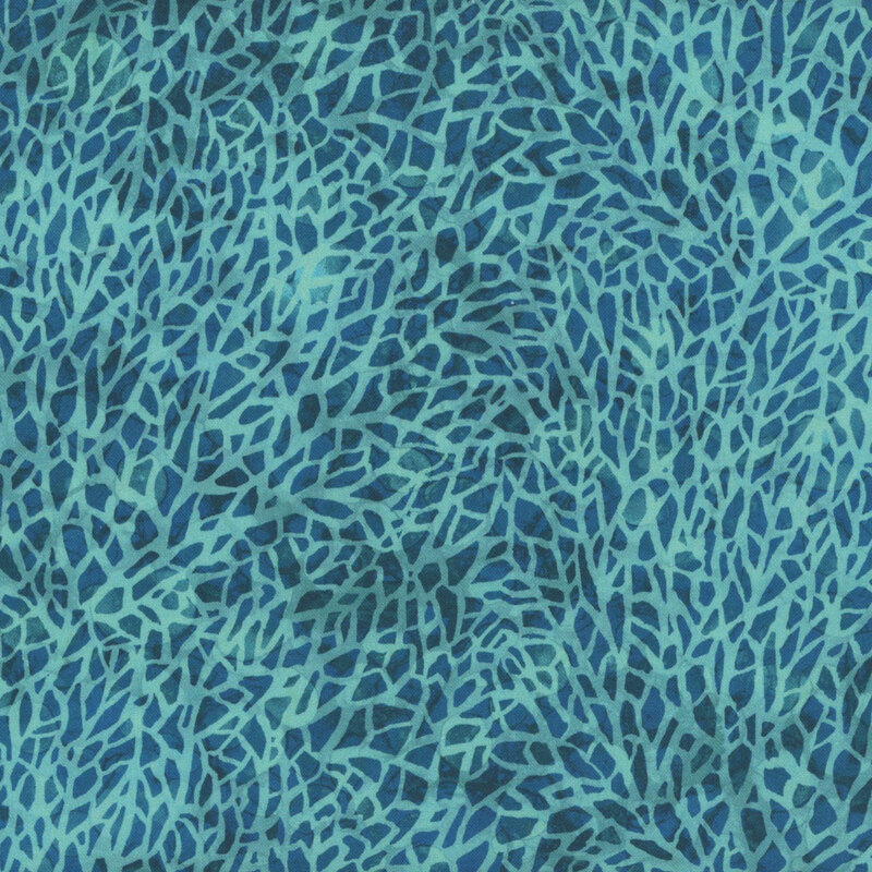 Mottled blue and aqua fabric with a mosaic or cracked textured look