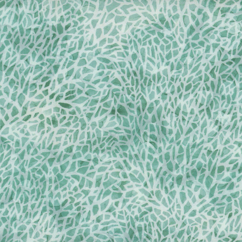 Mottled white and aqua fabric with a mosaic or cracked textured look