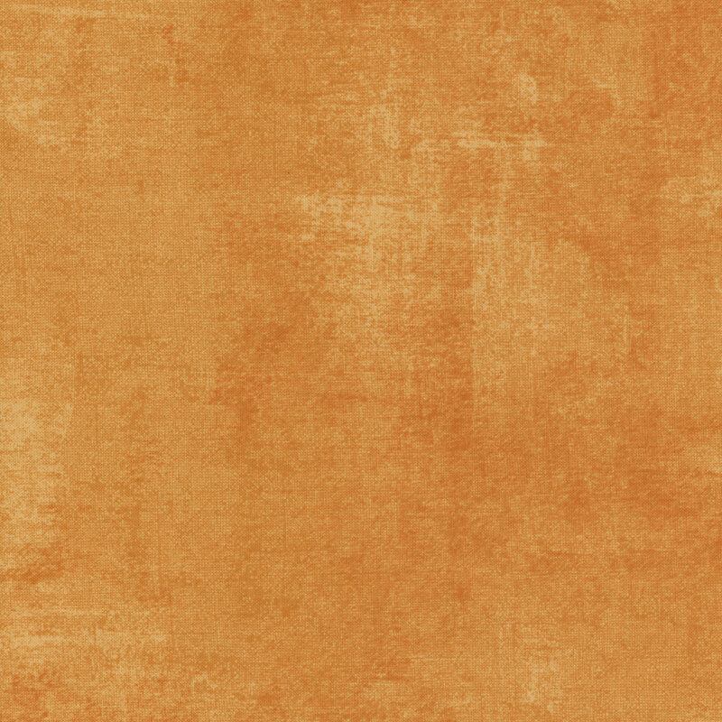 orange fabric featuring a darker dry-brushed texturing