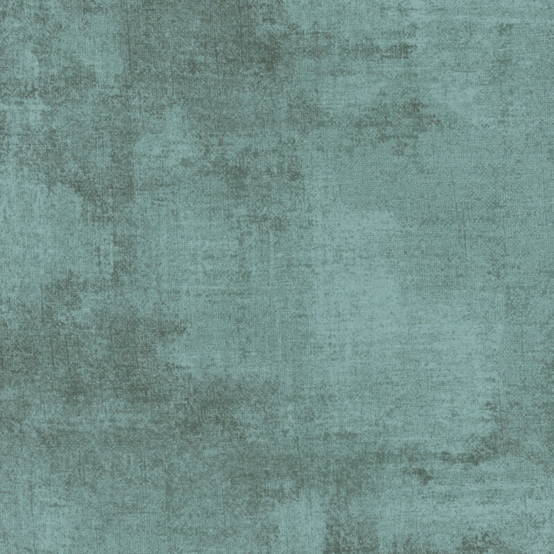 teal fabric featuring dark teal dry-brushed texturing
