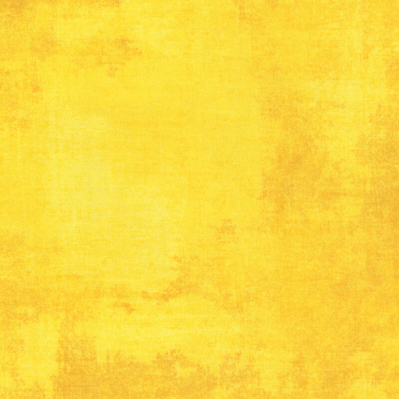 brilliant yellow fabric featuring golden orange dry-brushed texturing