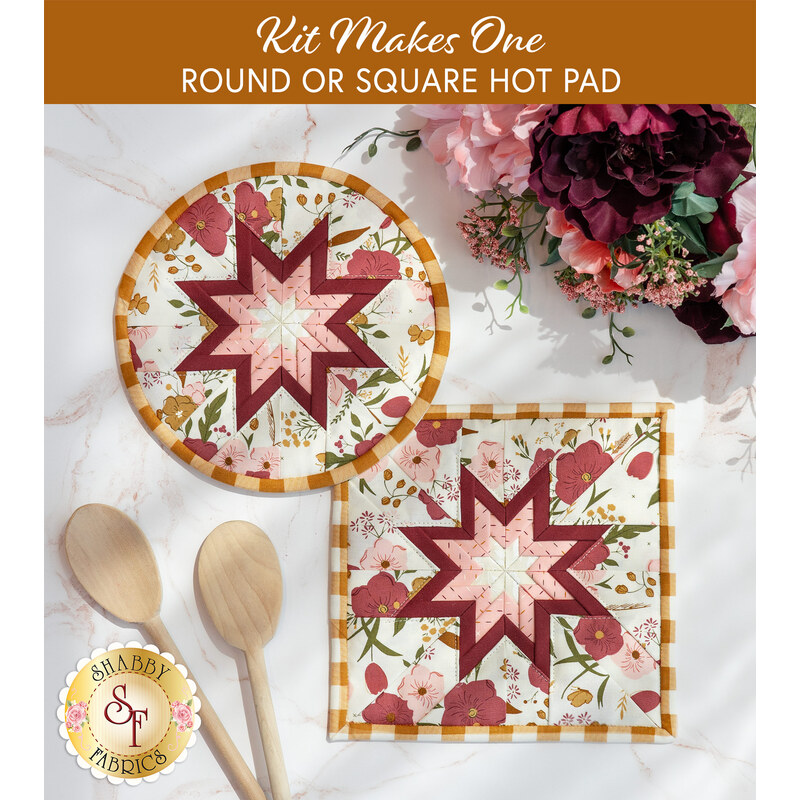 Photo of two folded star hot pads, one round and one square, made with pink, white, and red floral fabrics and yellow gingham laying flat on a white countertop with wooden spoons and a bouquet of flowers