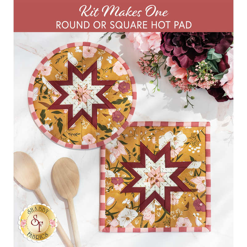 Photo of two folded star hot pads, one round and one square, made with yellow, white, and red floral fabrics laying flat on a white countertop with wooden spoons and a bouquet of flowers
