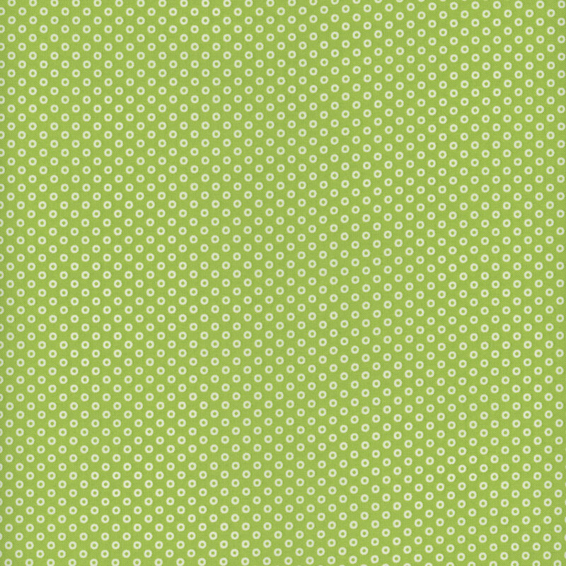 White hollow polka dots on a lime green background