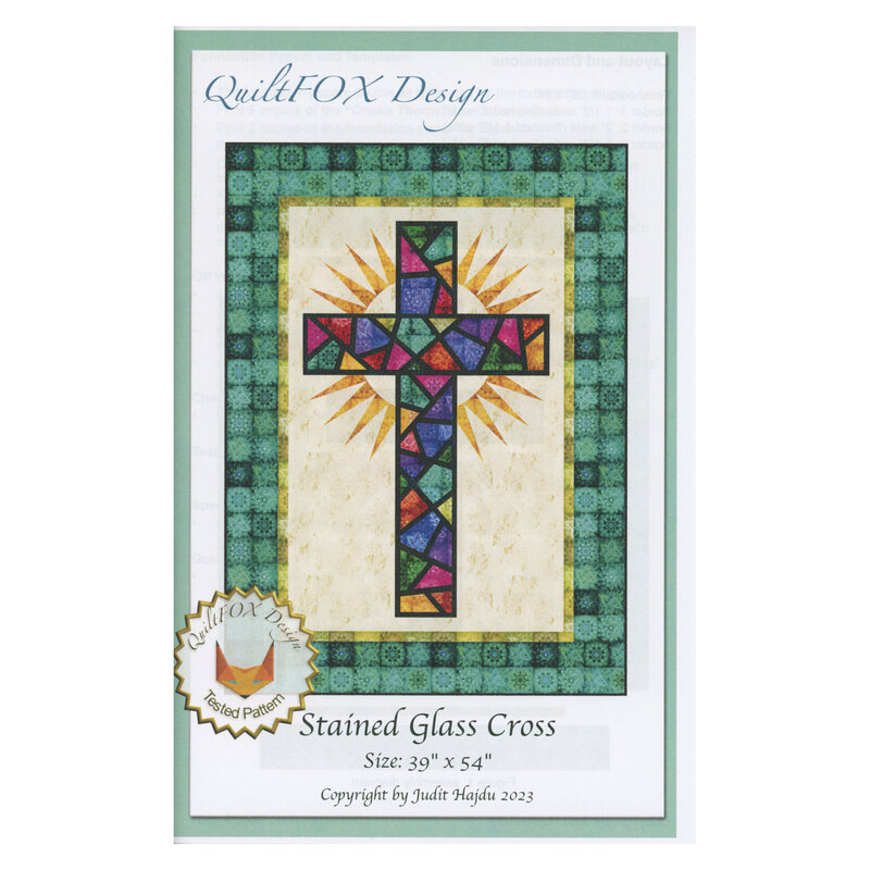 Front of pattern depicting a stained glass cross with a bright golden crown of thorns behind it, bordered in green floral fabrics