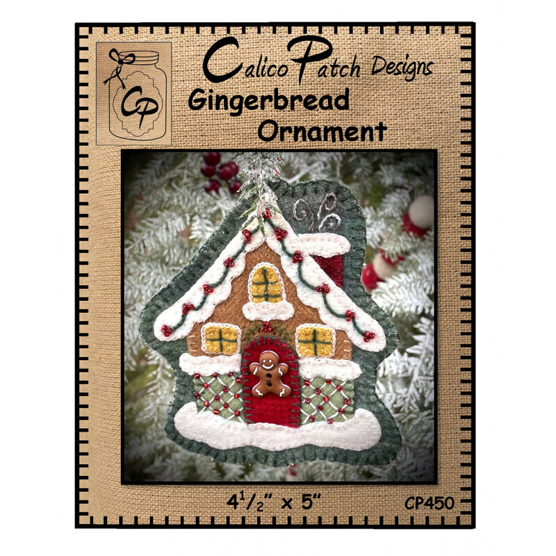 The front of the Gingerbread Ornament pattern showing the finished ornament with 3 glowing windows and a gingerbread on the door, staged on a christmas tree
