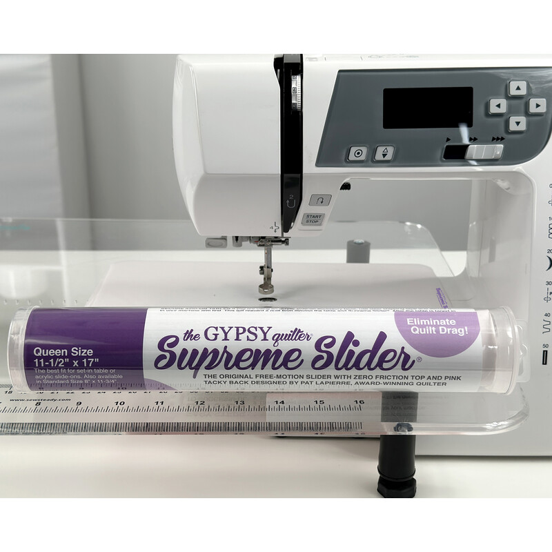 Supreme Slider tube staged against a sewing machine