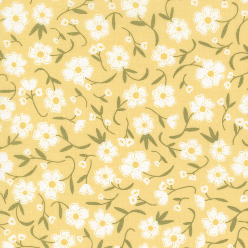Swatch of light yellow fabric with tossed white flowers