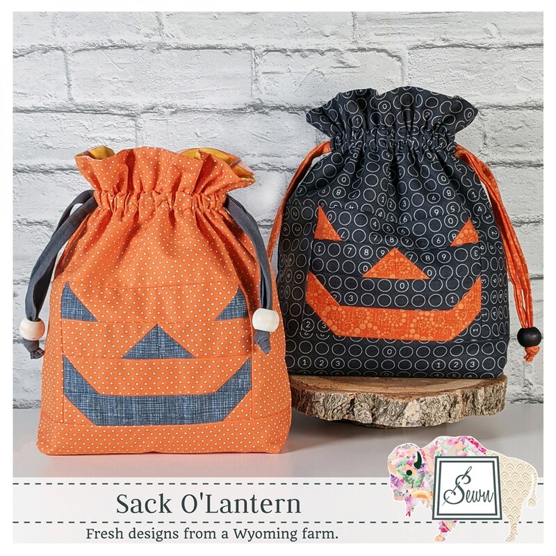 Front of Sack O'Lantern pattern, showing two completed sacks in orange and black 