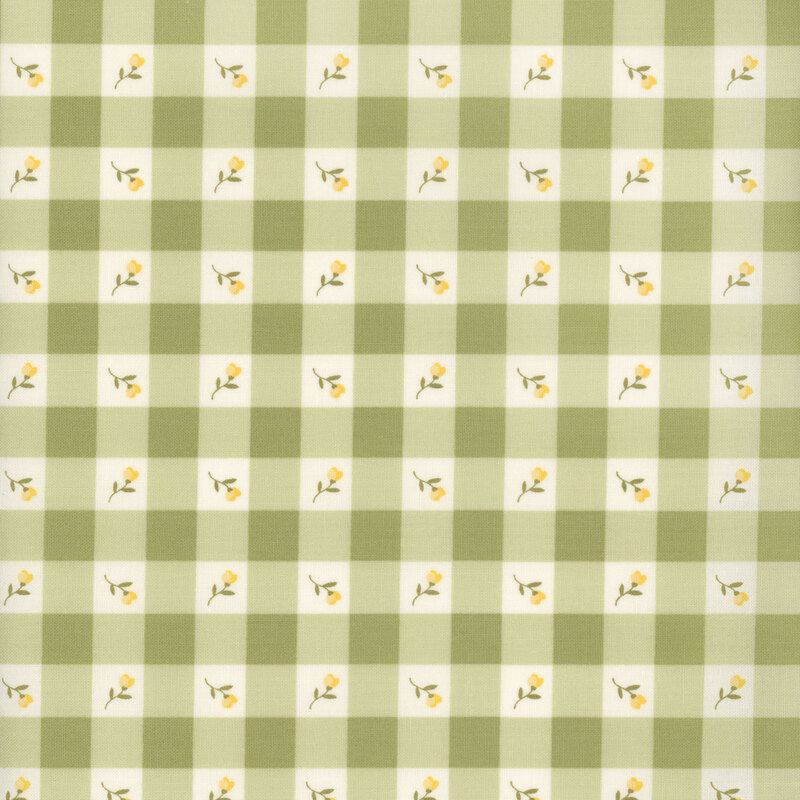 Swatch of light green gingham fabric with placed yellow flowers